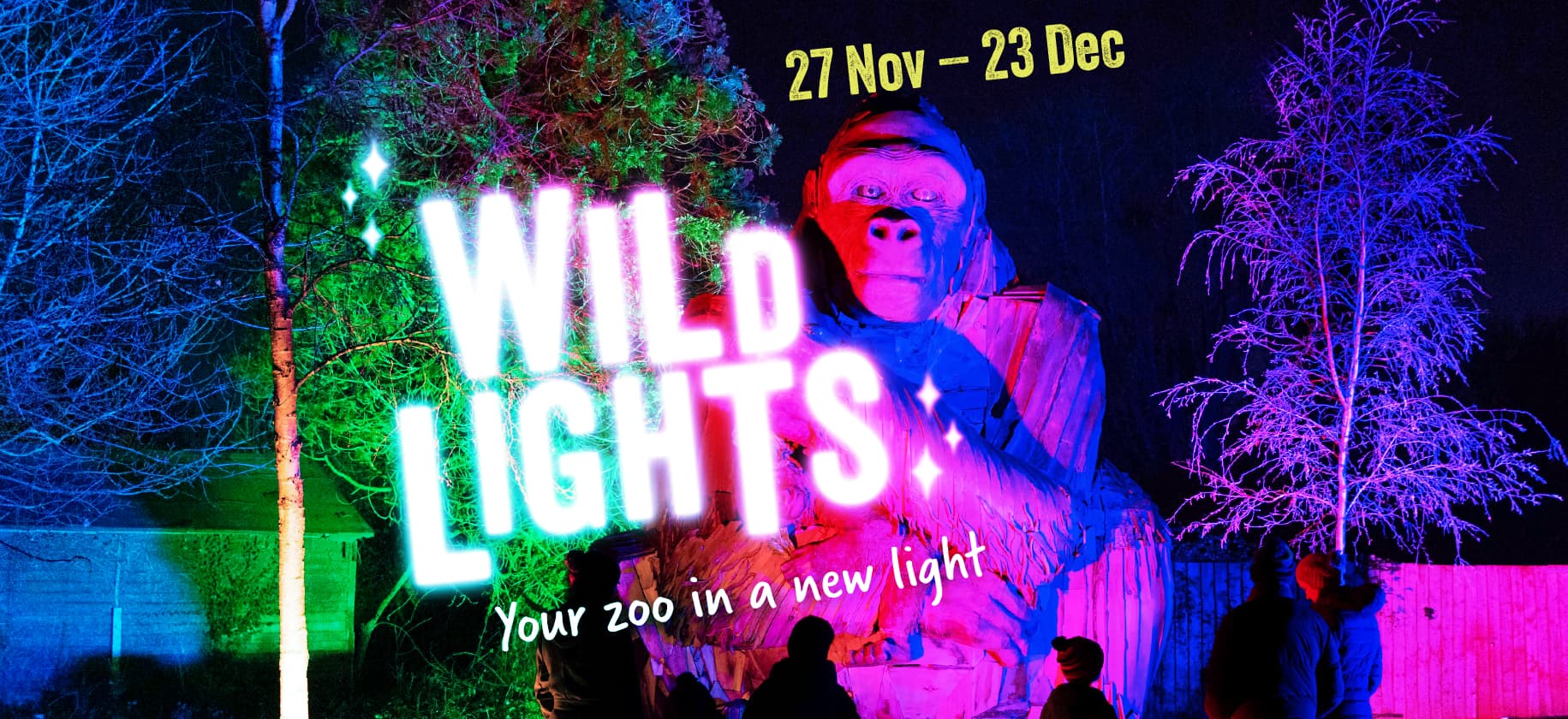 Illuminated gorilla statue with colourful lights and trees in a night zoo event. Text reads, "Wild Lights: Your zoo in a new light, 27 Nov - 23 Dec."